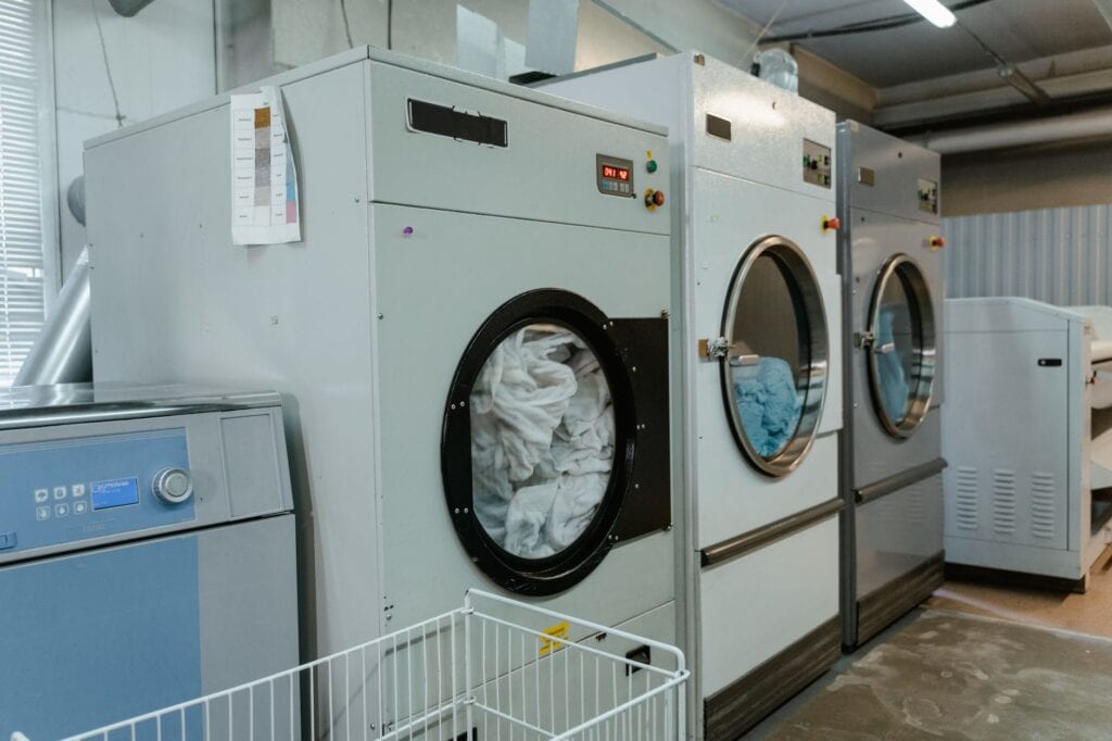 Why Your Dryer Smells Like Burning: A 2026 Safety Guide for Florida Homes 1 technician inspecting dryer vent after homeowner reports dryer smells like burning